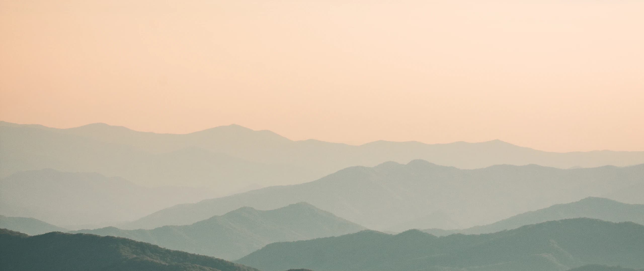 Dawn breaking over ridgelines